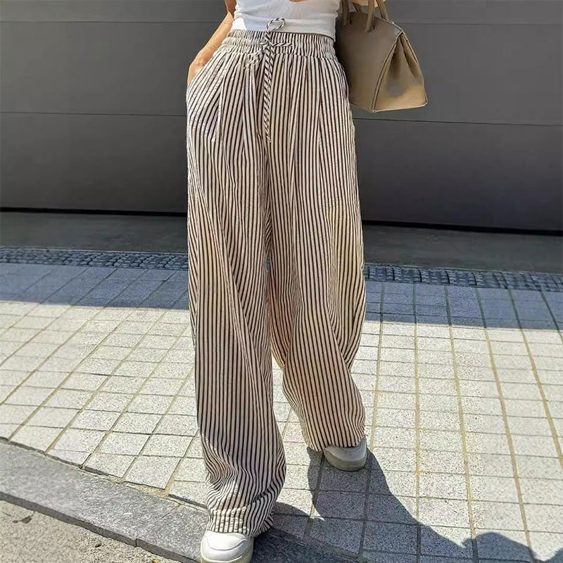 Lockere und vielseitige Hose mit hoher Taille und weitem Bein und elastischem Bund