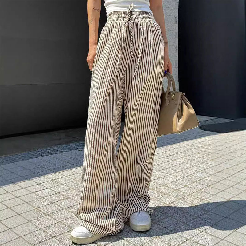 Lockere und vielseitige Hose mit hoher Taille und weitem Bein und elastischem Bund