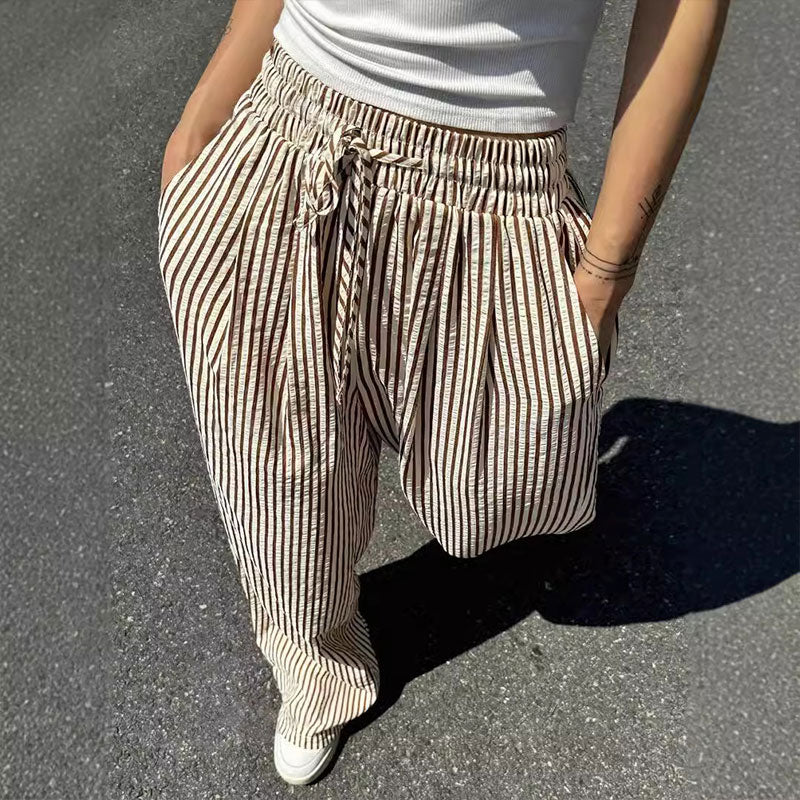 Lockere und vielseitige Hose mit hoher Taille und weitem Bein und elastischem Bund