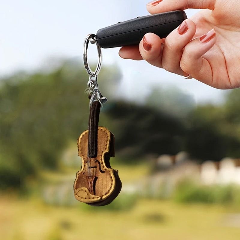 Handgefertigter Schlüsselanhänger aus Leder mit Violine und Cello