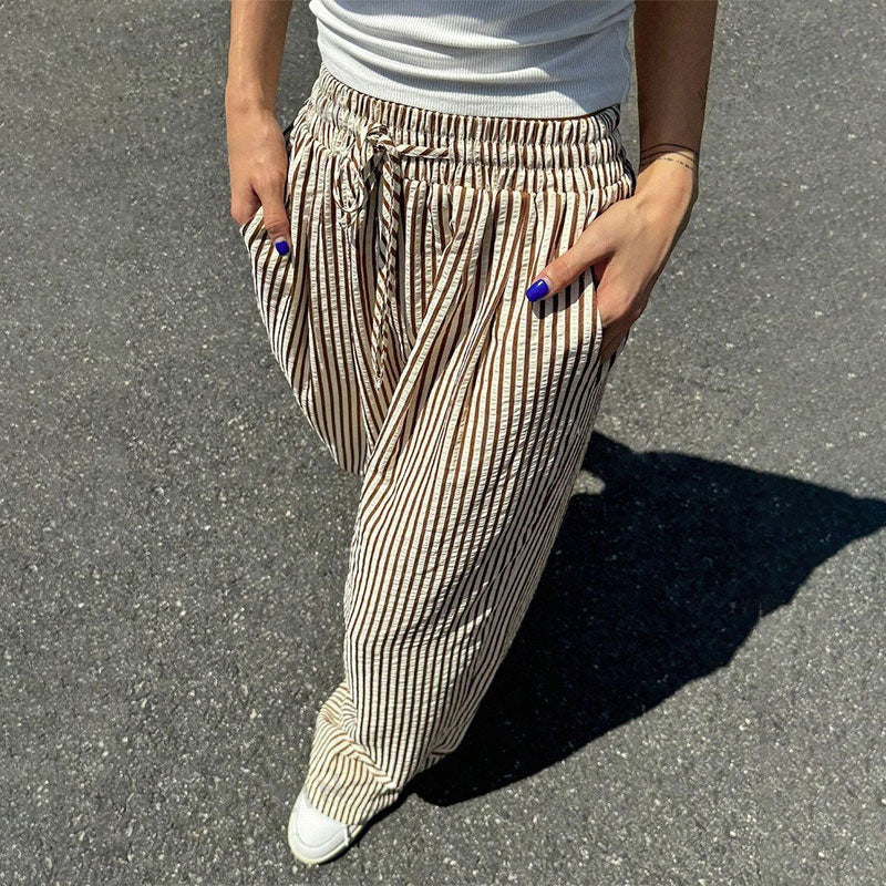 Lockere und vielseitige Hose mit hoher Taille und weitem Bein und elastischem Bund