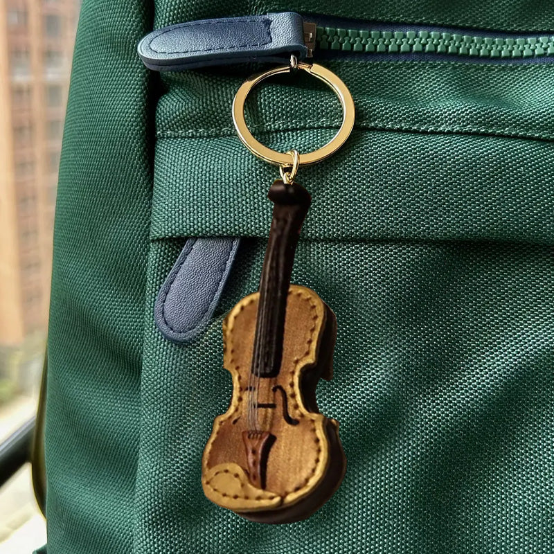 Handgefertigter Schlüsselanhänger aus Leder mit Violine und Cello
