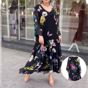 Geblümtes, langärmliges schwarzes Kleid